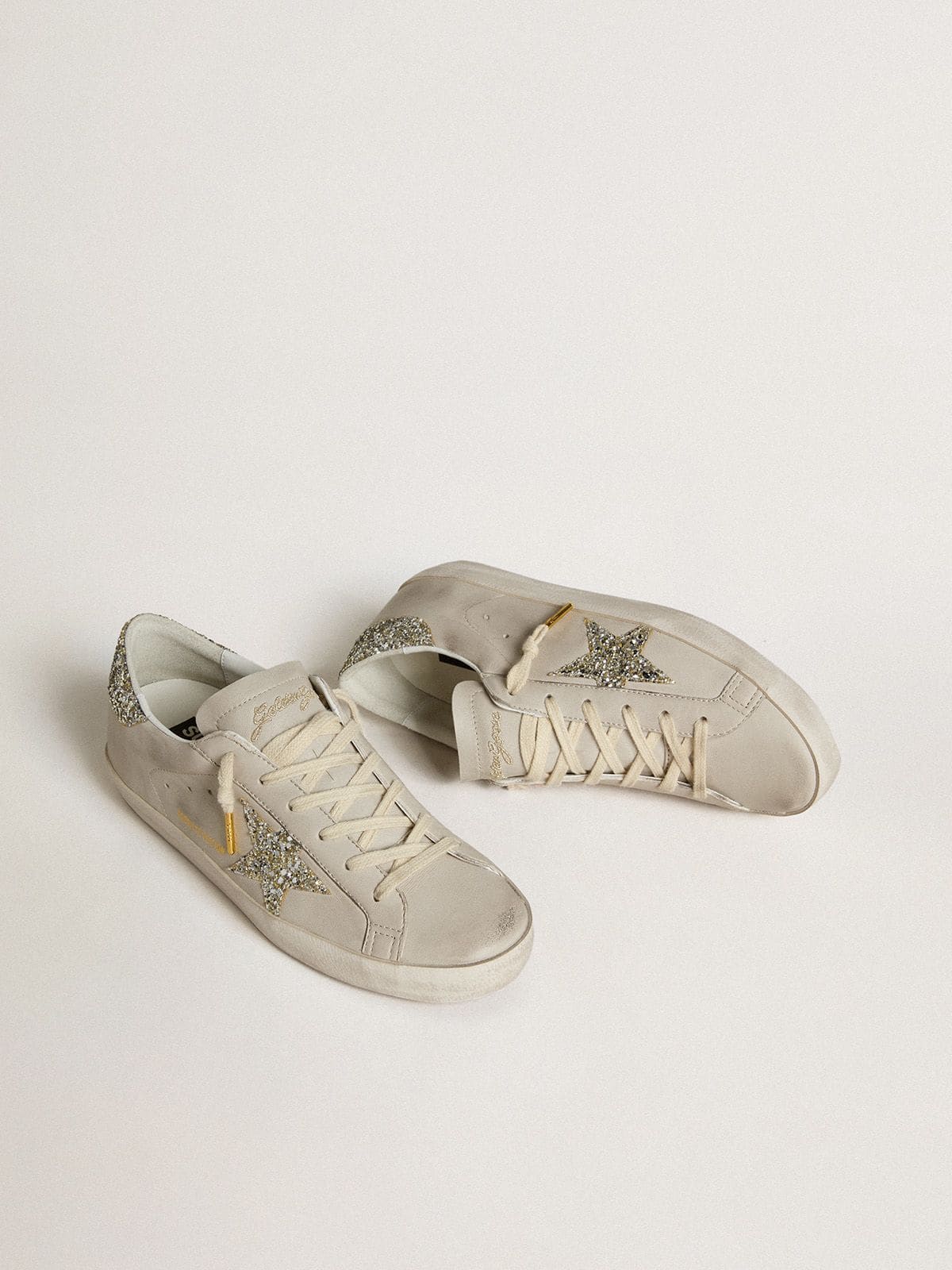LTD in nappa avorio con stella e talloncino in glitter platino