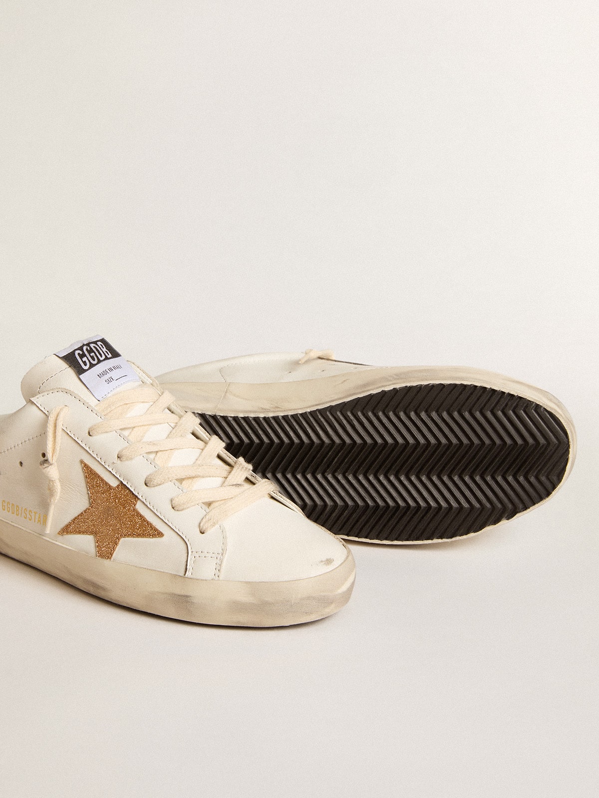 Sabot in pelle con stella in glitter oro plastificati