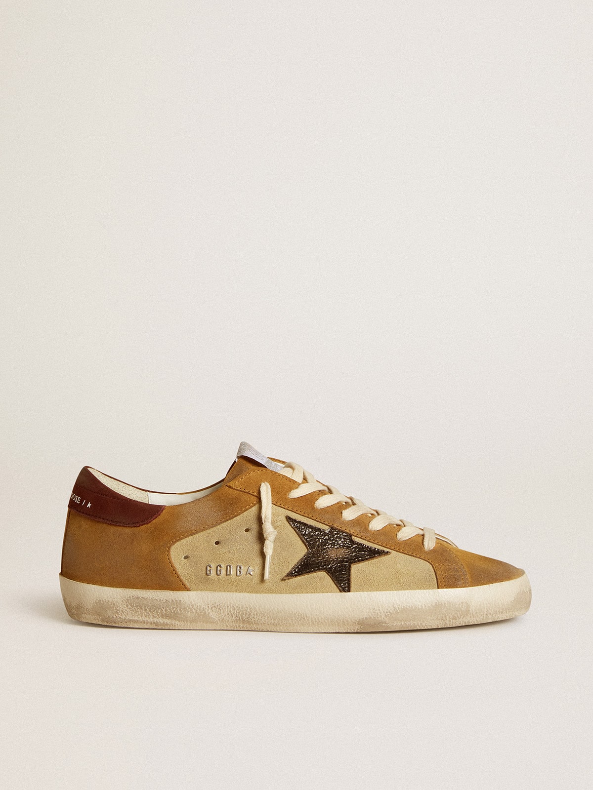 Suede beige e caramello con stella in pelle cracklé nera