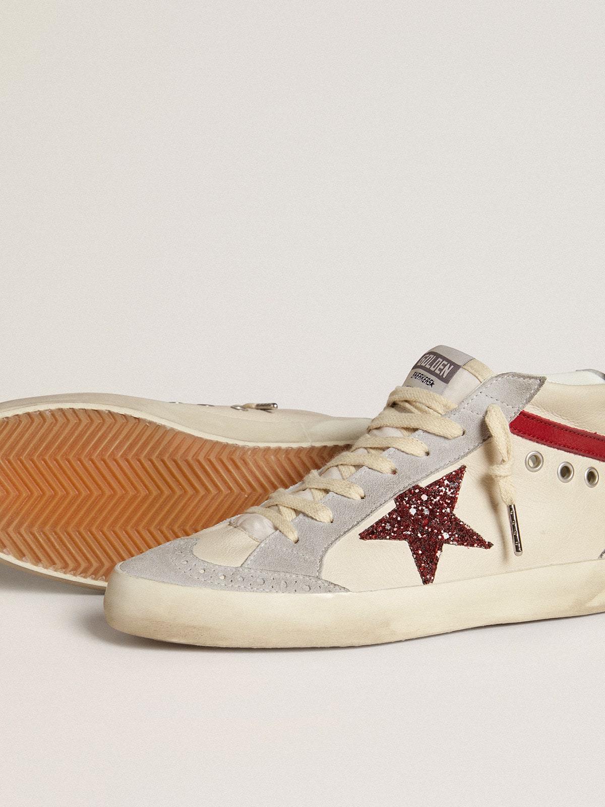 Pelle con stella in glitter e virgola in nabuk rosso
