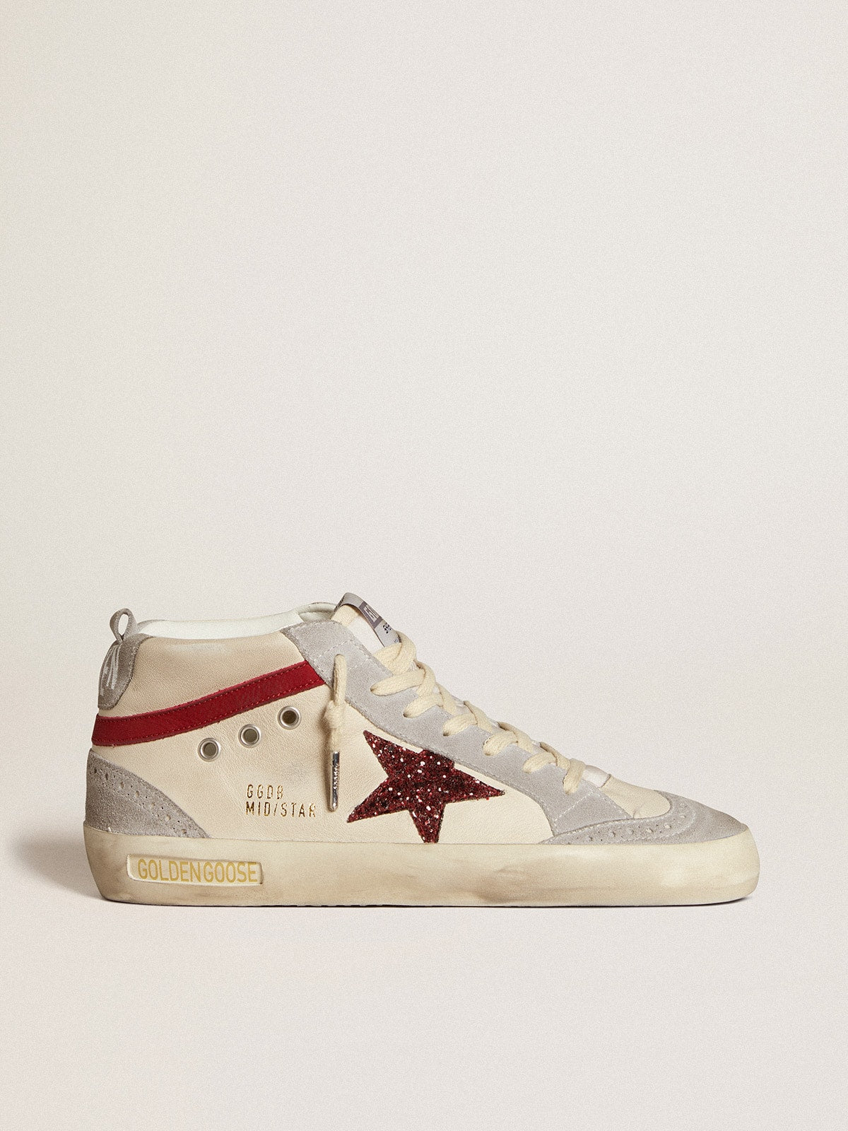 Pelle con stella in glitter e virgola in nabuk rosso